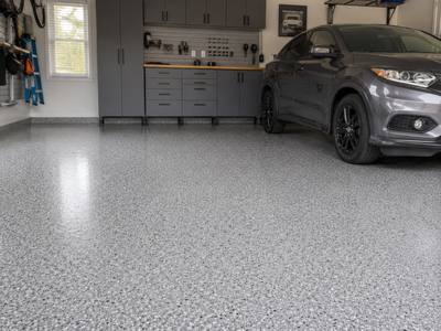 Finished garage floor with a vehicle parked on it