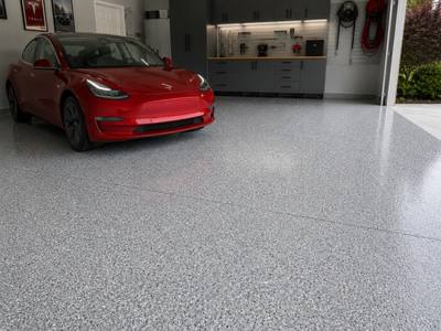 Vehicle parked on a finished single bay garage floor