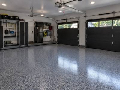 Grey chip floor across both bays of a double garage