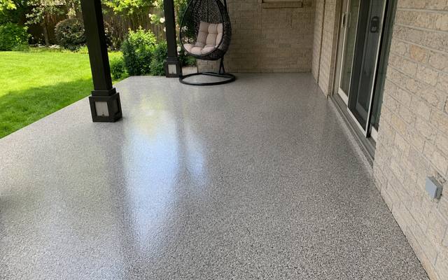 Covered outdoor slab coated and sealed right to the edge